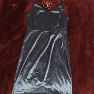 Selling a Teal, shiny dress for a night out.